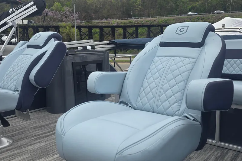 Slide: The Image of Luxurious seating on 2026 Godfrey Sweetwater 2286 SFL boat, featuring quilted blue upholstery. - 3