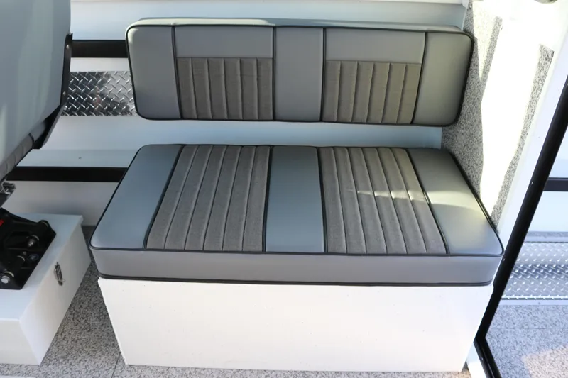 Slide: The Image of Gray cushioned seating in 2026 Alumaweld Horizon 26 boat interior. - 10