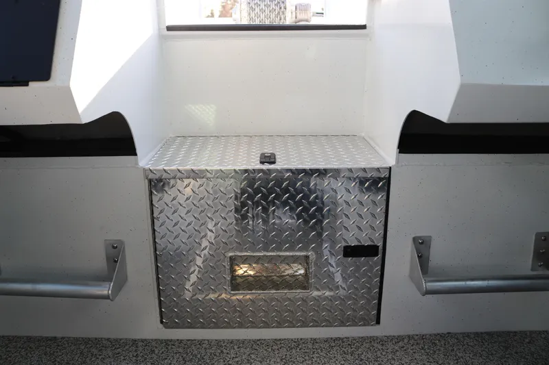 Slide: The Image of Alumaweld Horizon 26 (2026) interior with diamond plate storage compartment. - 12