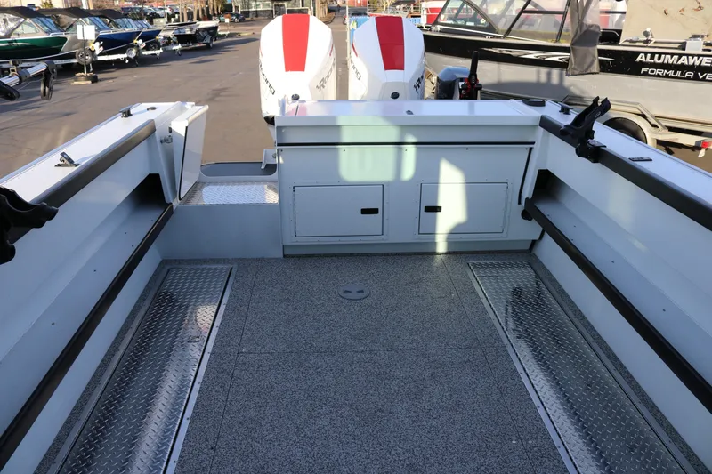 Slide: The Image of 2026 Alumaweld Horizon 26 boat interior with spacious deck and storage compartments. - 18
