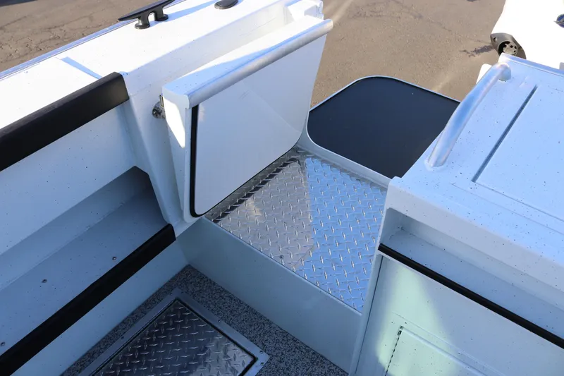 Slide: The Image of Alumaweld Horizon 26 boat interior with diamond plate flooring, 2026 model. - 21