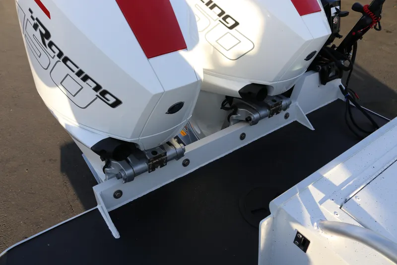 Slide: The Image of Twin outboard motors on a 2026 Alumaweld Horizon 26 boat, featuring iRacing 300 branding. - 22