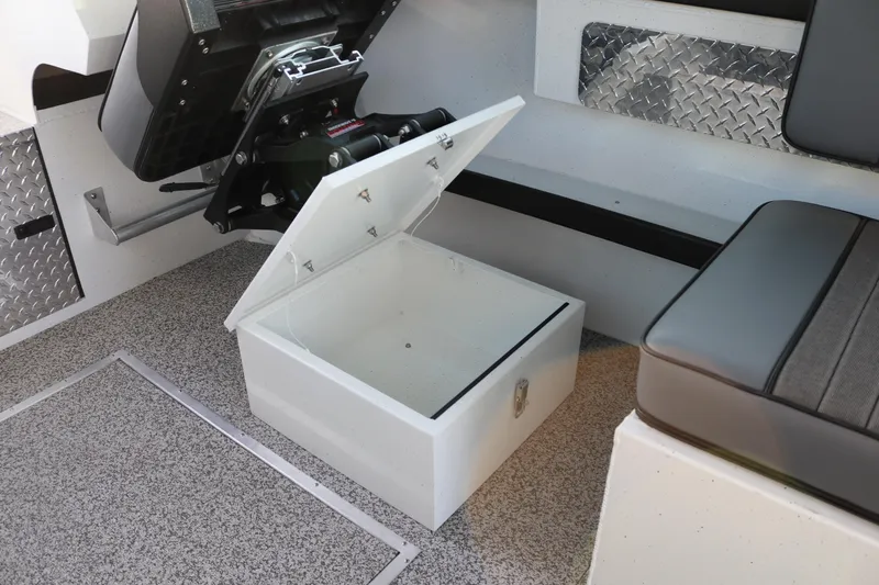 Slide: The Image of Open storage compartment in 2026 Alumaweld Horizon 26 boat interior. - 7
