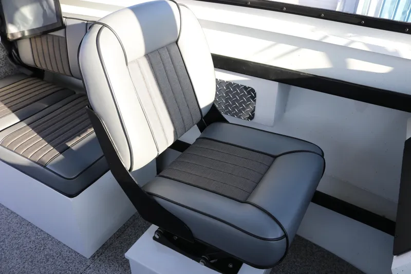 Slide: The Image of 2026 Alumaweld Horizon 26 boat interior with gray cushioned seating. - 8
