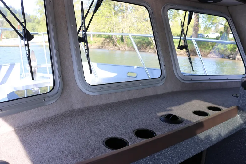Slide: The Image of Interior view of 2026 KingFisher 3025 XRS boat with large windows and cup holders. - 10