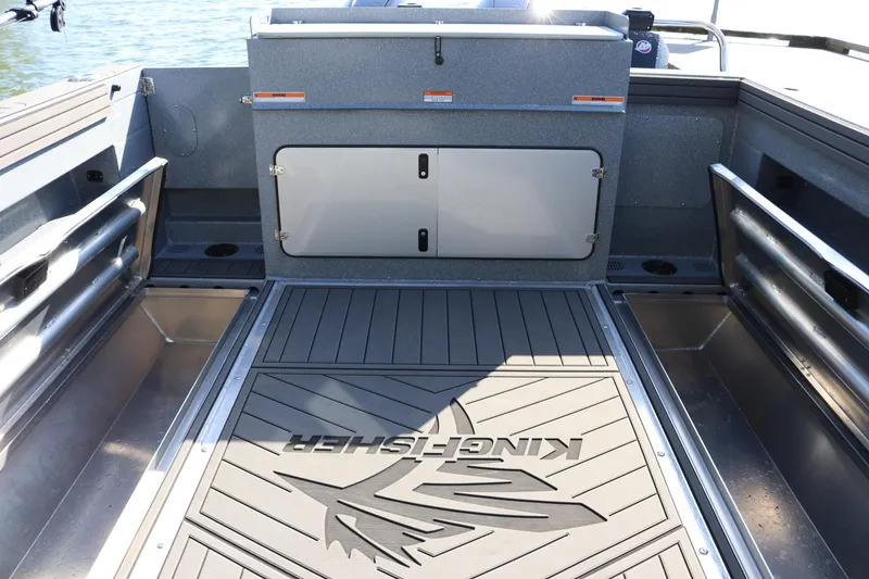 Slide: The Image of 2026 KingFisher 3025 XRS boat interior with sleek flooring and storage compartments. - 15