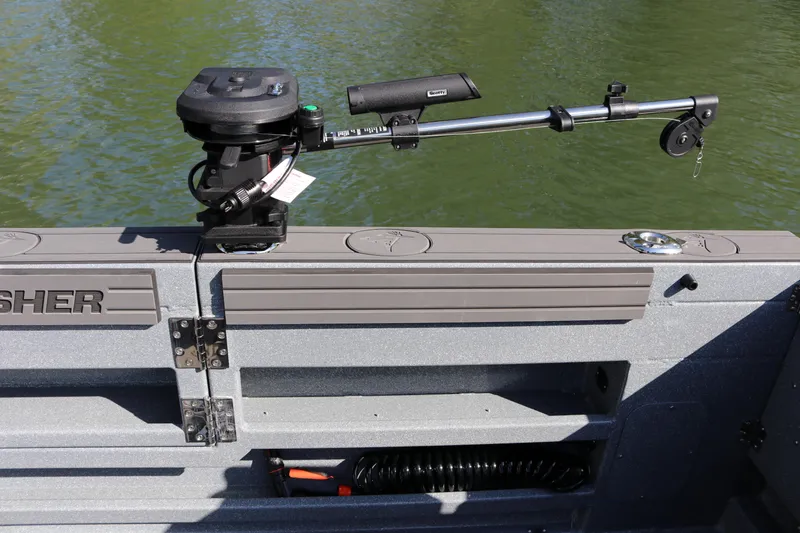 Slide: The Image of Fishing rod holder on KingFisher 3025 XRS boat, 2026 model, near water. - 22