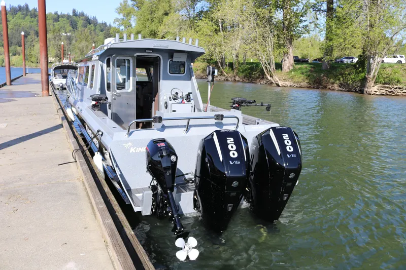 Slide: The Image of 2026 KingFisher 3025 XRS boat docked with dual Mercury 200 V6 engines. - 25