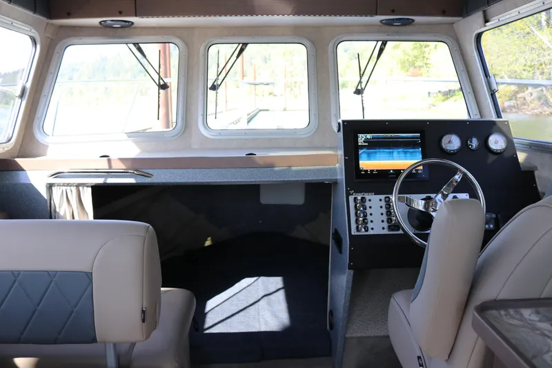 Slide: The Image of Interior of 2026 KingFisher 3025 XRS boat with modern dashboard and seating. - 5