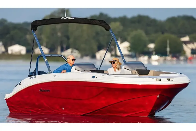 Slide: The Image of Manufacturer Provided Image: 2026 Hurricane SunDeck Sport 2050 OB boat cruising on a lake with passengers. - 3