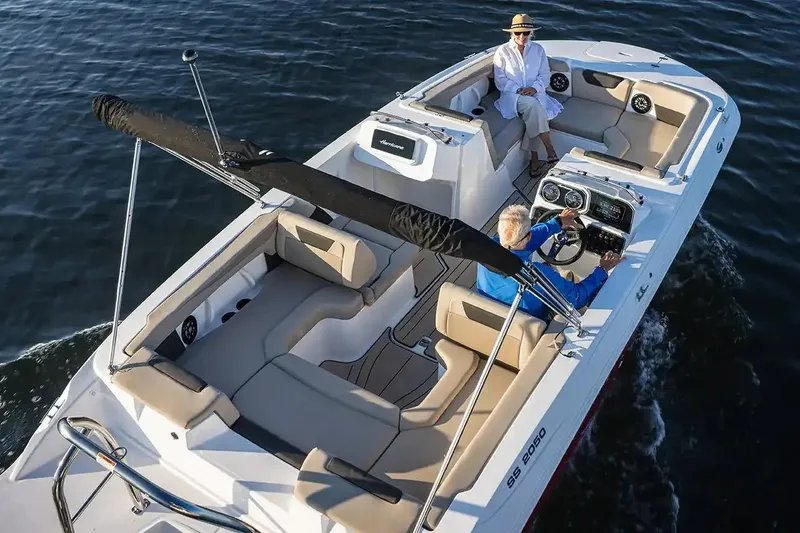 Slide: The Image of Manufacturer Provided Image: 2026 Hurricane SunDeck Sport 2050 OB boat cruising on calm water. - 4