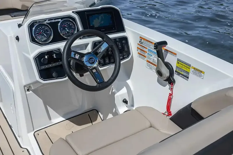 Slide: The Image of Manufacturer Provided Image: 2026 Hurricane SunDeck Sport 2050 OB boat cruising with passengers on a sunny day. - 6