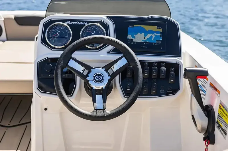 Slide: The Image of Manufacturer Provided Image: 2026 Hurricane SunDeck Sport 2050 OB boat interior with beige seating and steering wheel. - 7