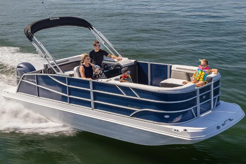 Slide: The Image of Manufacturer Provided Image: 2026 Hurricane FunDeck 2260 RE OB cruising on water with passengers enjoying the ride. - 2