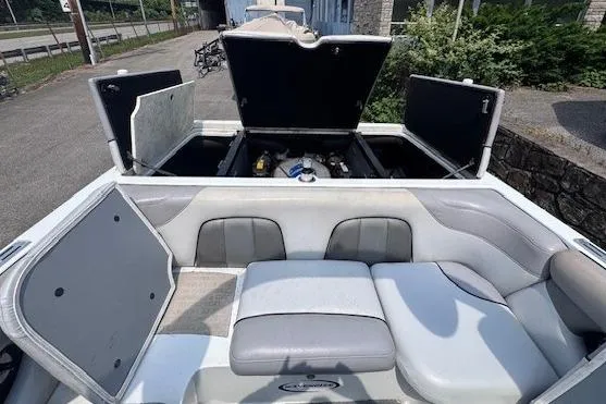 Slide: The Image of 2009 Centurion Avalanche C4 boat interior with open storage compartments and seating. - 5