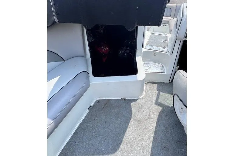 Slide: The Image of Interior of a 2009 Centurion Avalanche C4 boat, featuring seating and storage area. - 9