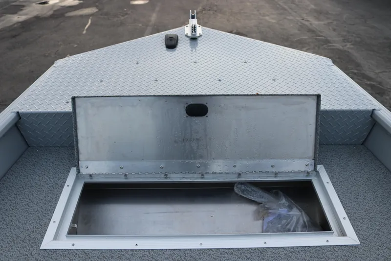 Slide: The Image of Open storage compartment on 2026 Smoker Craft Sportsman 1660 boat deck. - 10