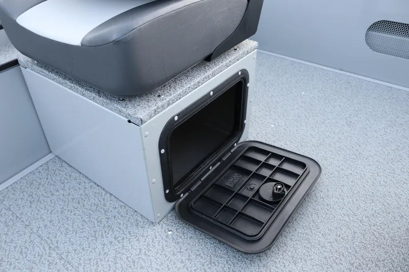 Slide: The Image of 2026 Smoker Craft Sportsman 1660 boat seat with open storage compartment. - 14
