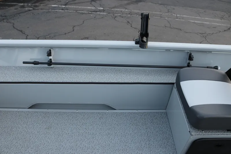 Slide: The Image of Interior of 2026 Smoker Craft Sportsman 1660 boat with rod holder and seating. - 15