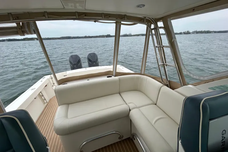 Slide: The Image of Interior view from a 2020 Hunt Yachts Surfhunter 32, overlooking a marina. - 18