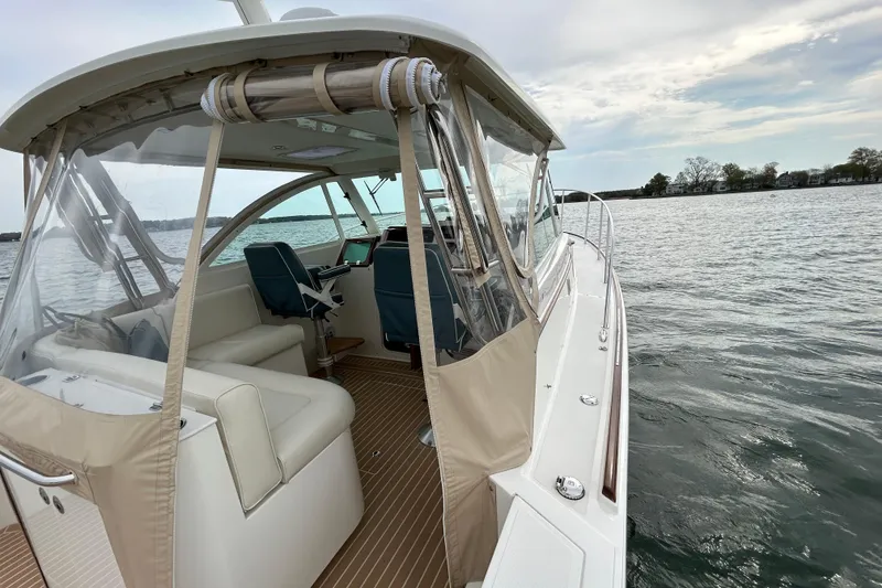 Slide: The Image of Storage compartment on 2020 Hunt Yachts Surfhunter 32 with safety equipment and life jackets. - 22