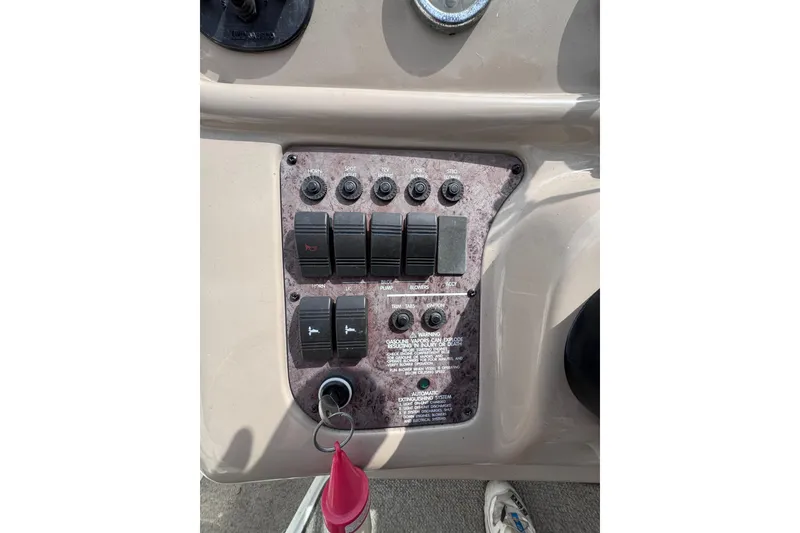Slide: The Image of Control panel of a 1999 Sea Ray 270 Sundancer Special Edition boat. - 11