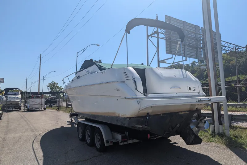Slide: The Image of 1999 Sea Ray 270 Sundancer Special Edition boat on trailer in outdoor setting. - 5