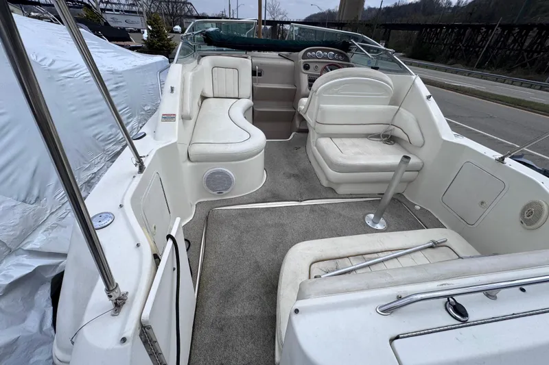 Slide: The Image of 1999 Sea Ray 270 Sundancer Special Edition boat interior with seating and dashboard. - 6