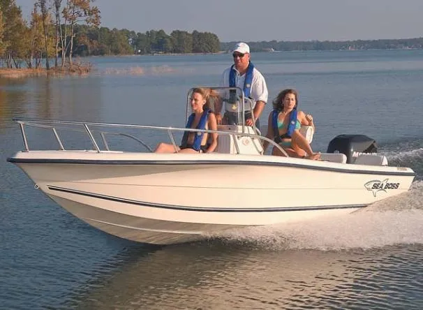 Slide: The Image of 2003 Sea Boss 180 Center Console boat docked on calm water. - 3