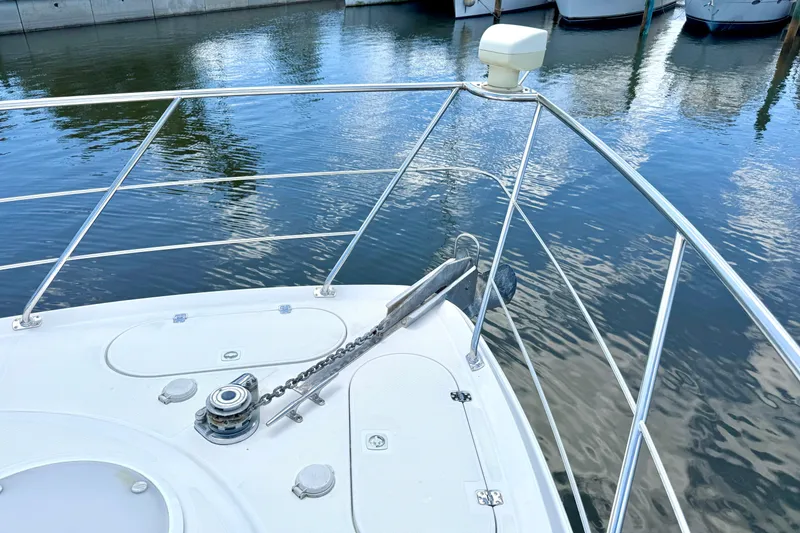 Slide: The Image of Bow of 1999 Carver 450 Voyager Pilothouse yacht with anchor and railing. - 10