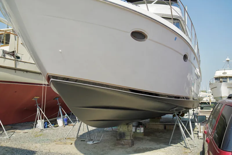 Slide: The Image of 1999 Carver 450 Voyager Pilothouse yacht on dry dock for maintenance. - 12
