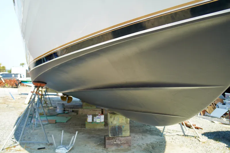Slide: The Image of 1999 Carver 450 Voyager Pilothouse yacht hull on dry dock for maintenance. - 14