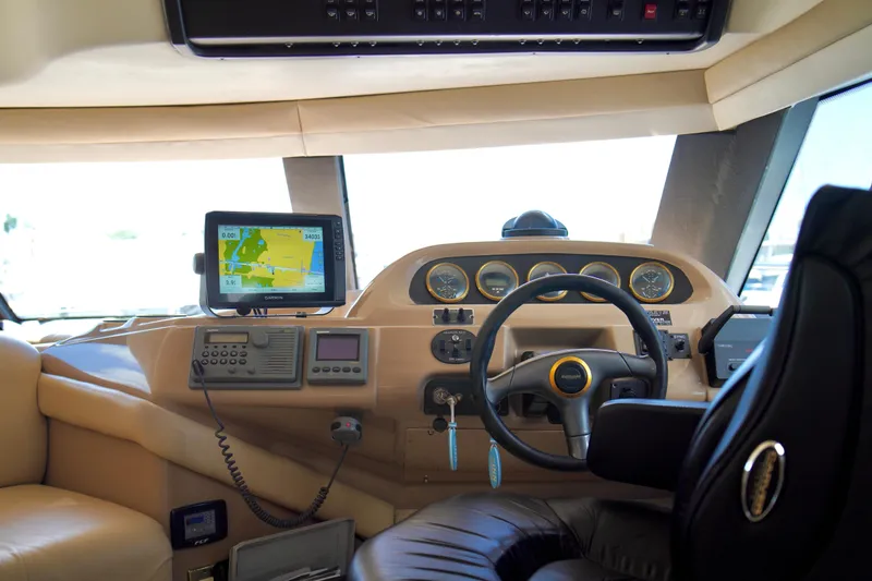 Slide: The Image of Interior cockpit of 1999 Carver 450 Voyager Pilothouse with navigation equipment and steering wheel. - 20