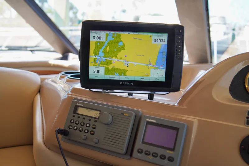 Slide: The Image of Navigation equipment on 1999 Carver 450 Voyager Pilothouse, featuring Garmin GPS display. - 26