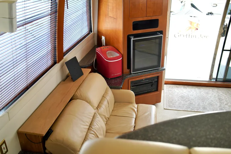 Slide: The Image of Interior of 1999 Carver 450 Voyager Pilothouse with leather seating and entertainment center. - 30
