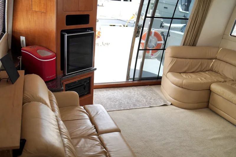 Slide: The Image of Luxurious interior of 1999 Carver 450 Voyager Pilothouse with leather seating and modern amenities. - 31