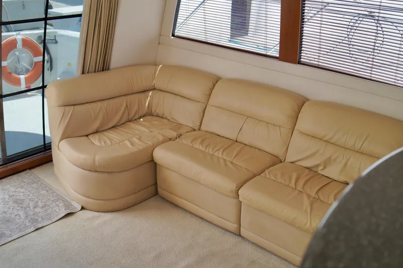 Slide: The Image of Luxurious beige leather sofa in 1999 Carver 450 Voyager Pilothouse interior. - 32