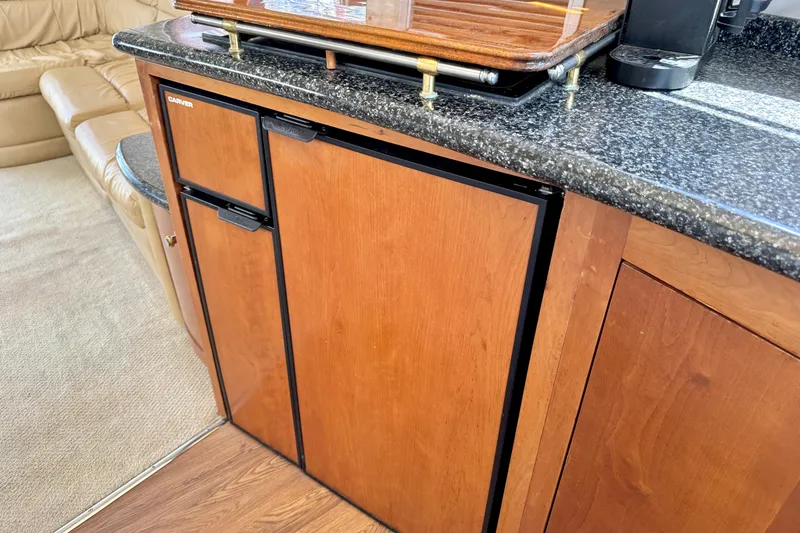 Slide: The Image of Wooden cabinetry and countertop in 1999 Carver 450 Voyager Pilothouse interior. - 35