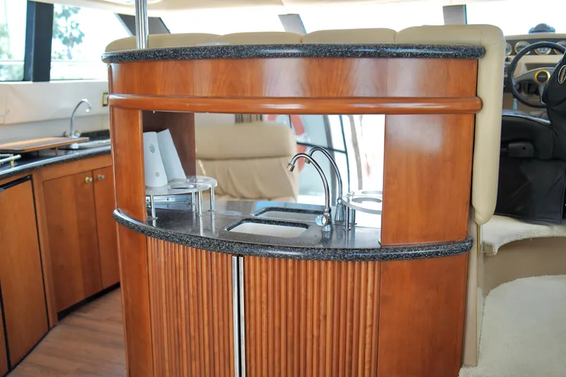 Slide: The Image of Luxurious interior of 1999 Carver 450 Voyager Pilothouse yacht with elegant wood cabinetry. - 37