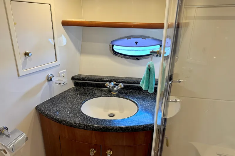 Slide: The Image of Luxurious bathroom in 1999 Carver 450 Voyager Pilothouse yacht with granite countertop. - 42