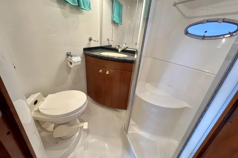 Slide: The Image of Bathroom interior of 1999 Carver 450 Voyager Pilothouse with shower and vanity. - 44