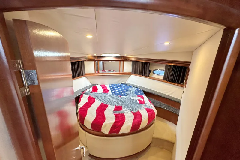 Slide: The Image of Cozy cabin interior of 1999 Carver 450 Voyager Pilothouse with American flag bedding. - 45