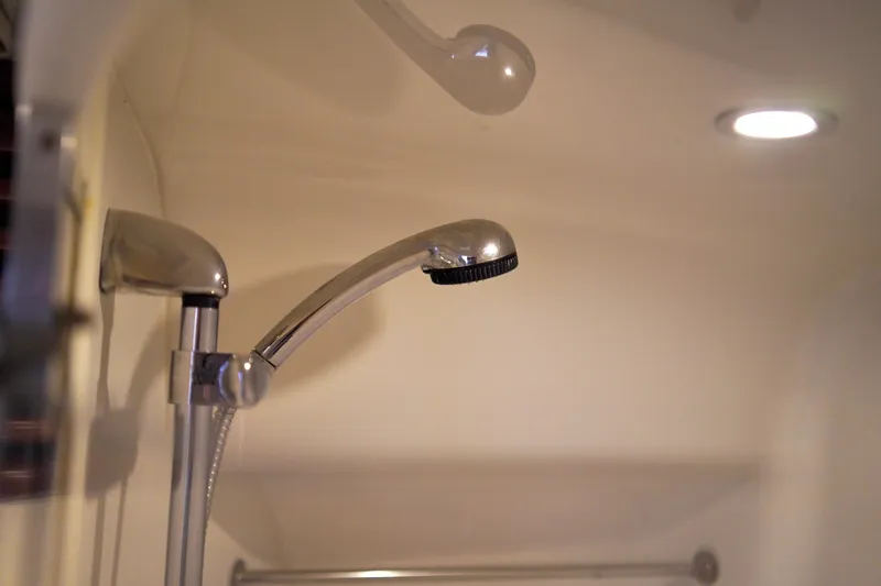 Slide: The Image of Showerhead in 1999 Carver 450 Voyager Pilothouse bathroom, featuring chrome finish and modern design. - 46