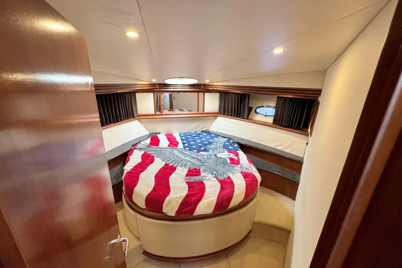 Slide: The Image of Cozy bedroom in 1999 Carver 450 Voyager Pilothouse with American flag bedding. - 47