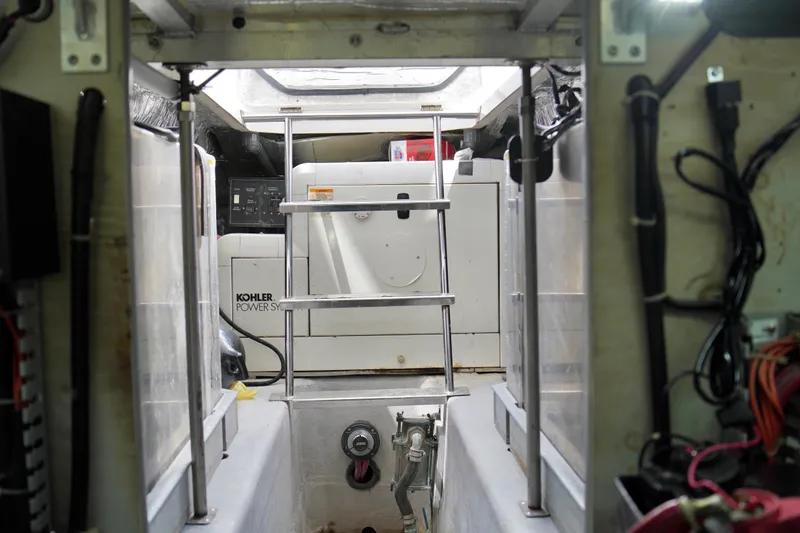 Slide: The Image of Engine room of 1999 Carver 450 Voyager Pilothouse with Kohler power system. - 49