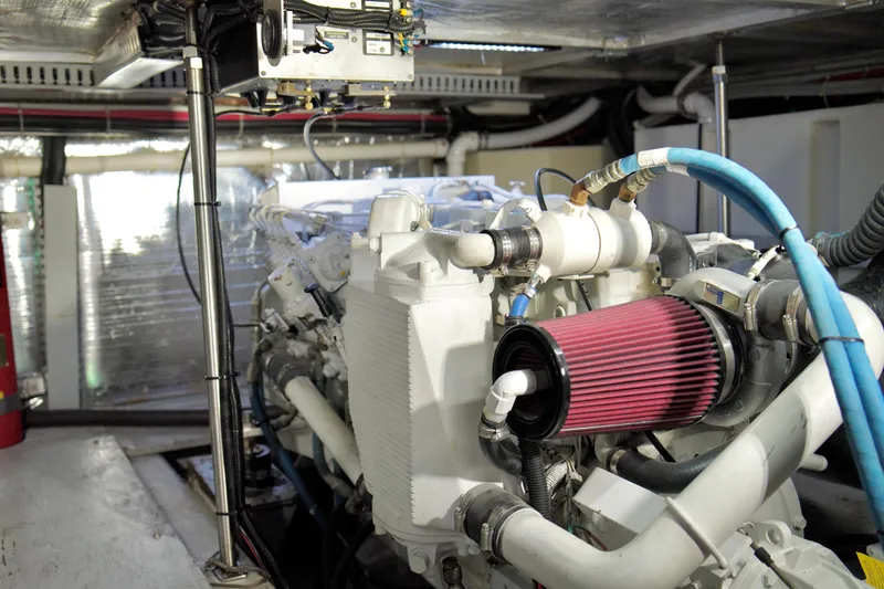Slide: The Image of Engine room of 1999 Carver 450 Voyager Pilothouse with visible components and wiring. - 50
