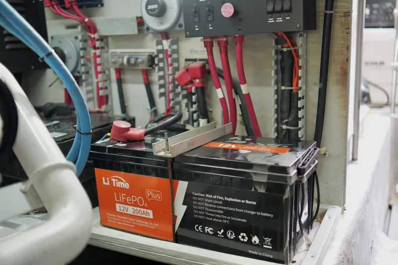 Slide: The Image of Battery setup in a 1999 Carver 450 Voyager Pilothouse engine room. - 58