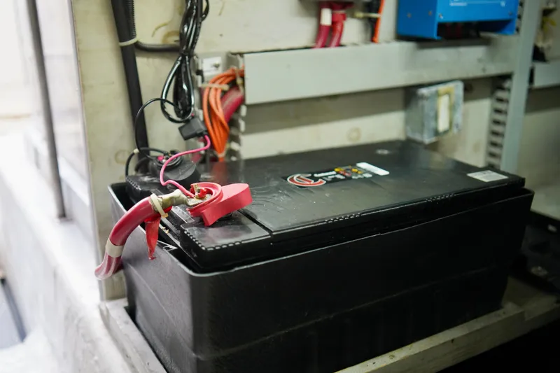 Slide: The Image of Battery setup in a 1999 Carver 450 Voyager Pilothouse engine room. - 59