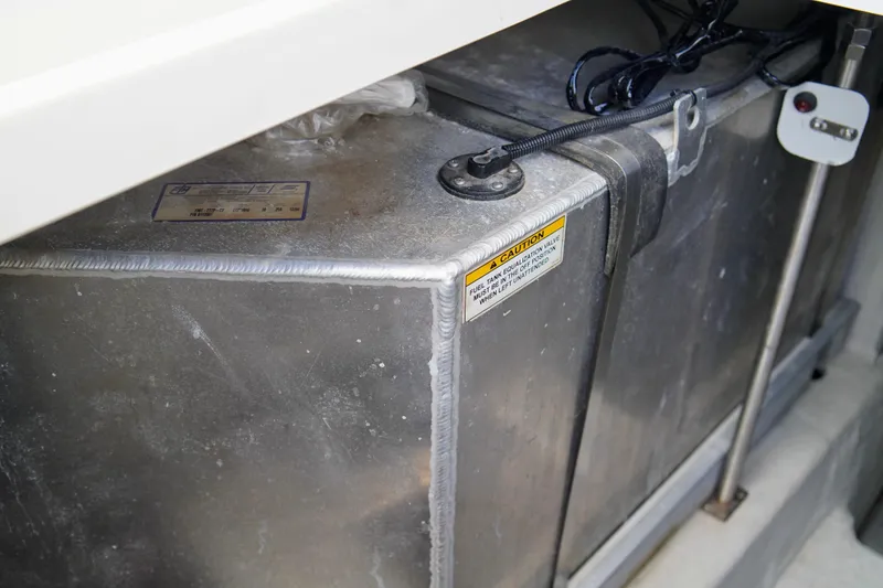 Slide: The Image of Fuel tank of a 1999 Carver 450 Voyager Pilothouse with caution label visible. - 63