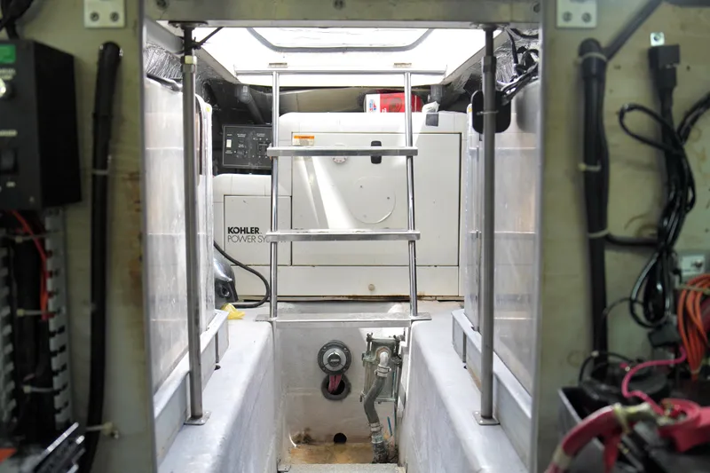 Slide: The Image of Engine room of 1999 Carver 450 Voyager Pilothouse with Kohler power system. - 64